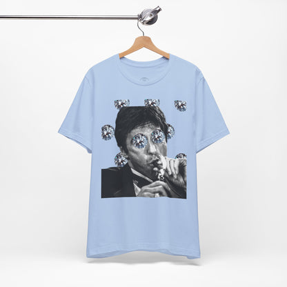 Light blue t-shirt with graphic design on a hanger against a white background